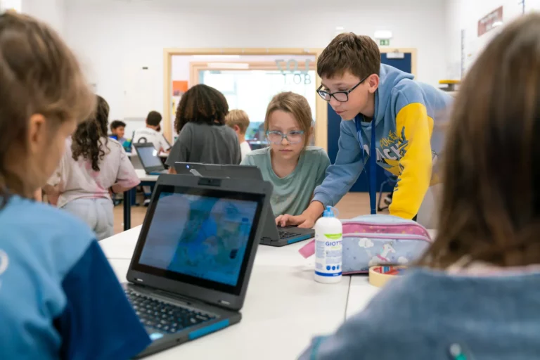 Children focusing on their Laptop